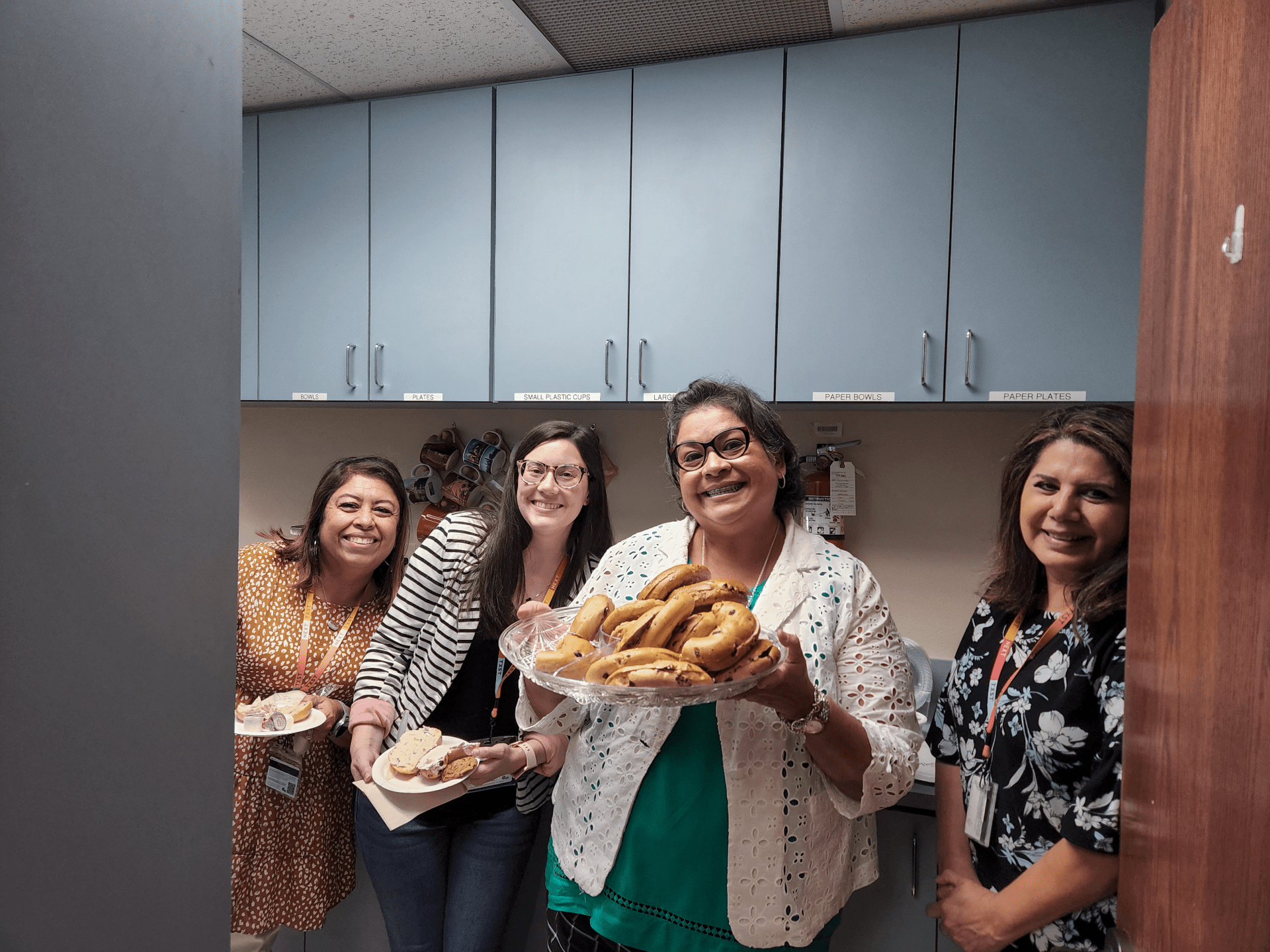 human resources staff holding bagels