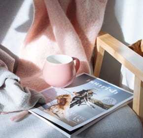 Image of coffee cup and magazine on table